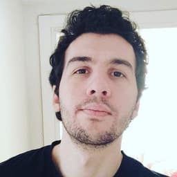 Engin Bağlayici smiling, Software Engineer at ASML based in Eindhoven, Netherlands